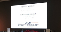 画像：アクセシビリティをテーマにしたグローバルカンファレンス「CSUN」のスライドが映し出された写真。