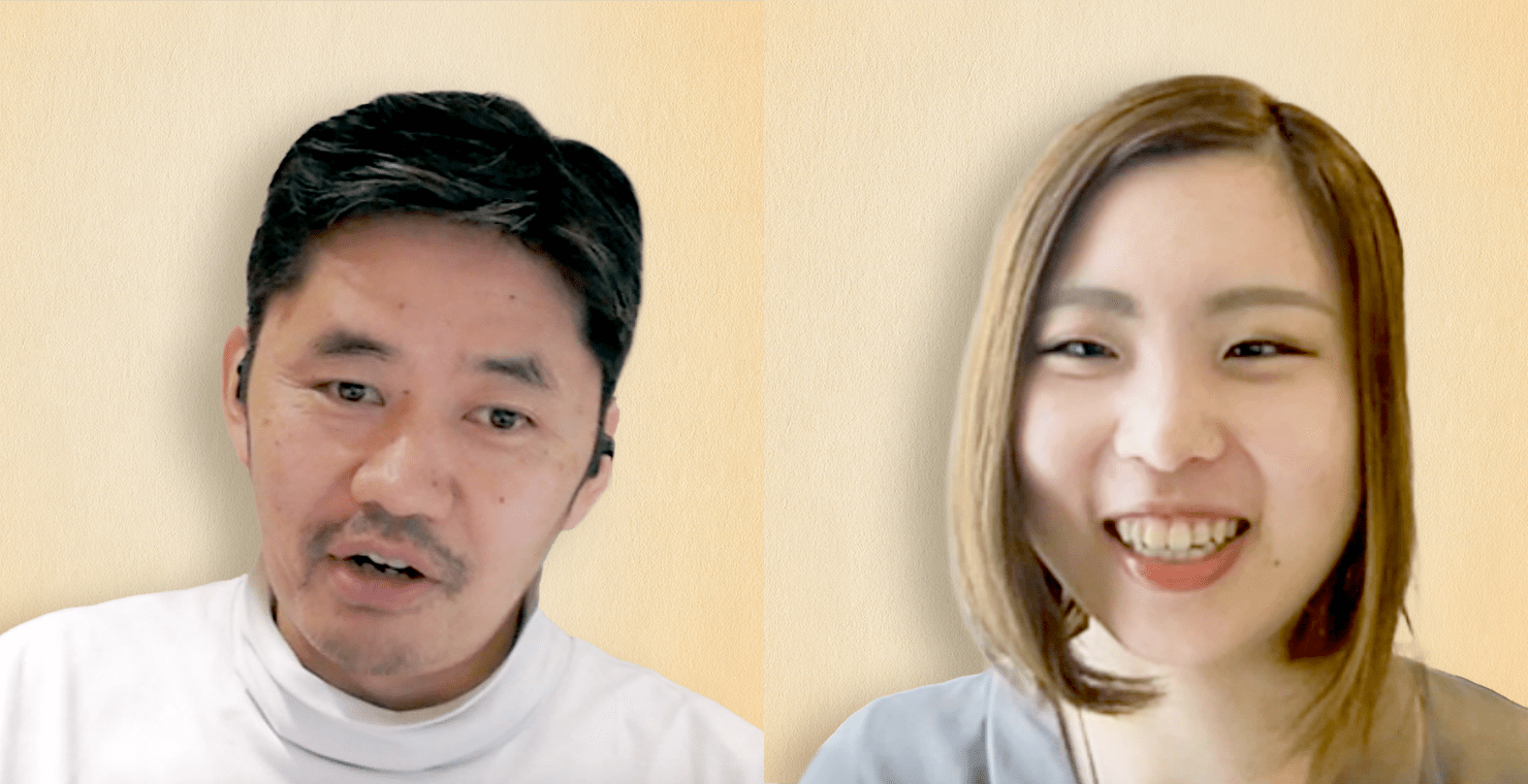 写真:対談中の長谷川と冨田の様子。