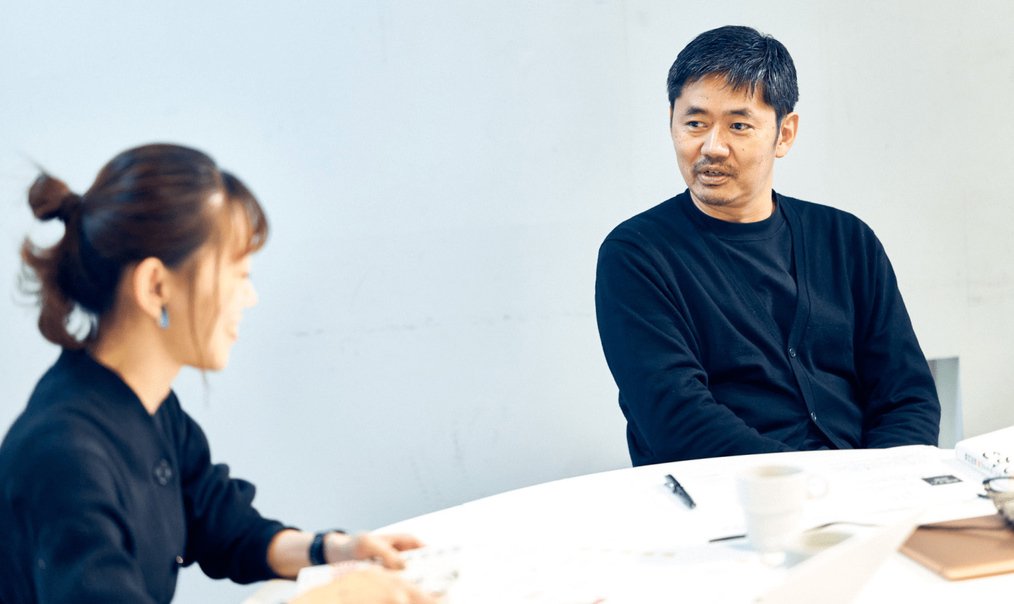 写真:長谷川が発言している様子。