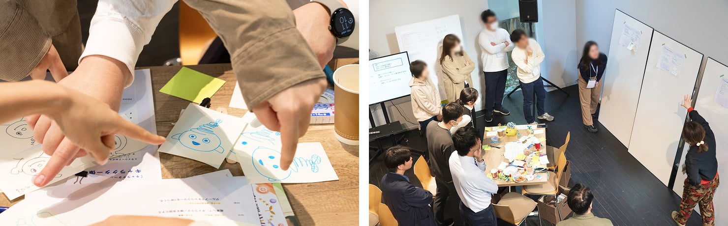 ワークショップで参加者が議論している様子。キャラクターを描いたラフや、ワークシートを見ながら意見を交わしている。