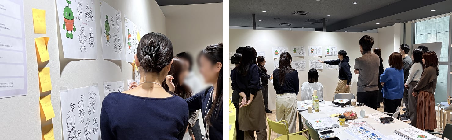 壁に貼られた複数のキャラクター案に対して、参加者が付箋で投票している様子。