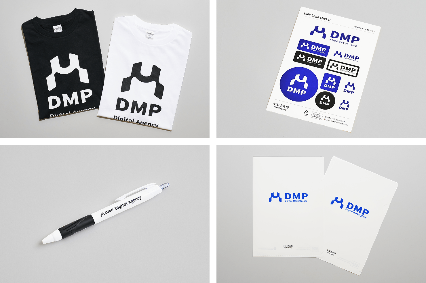 DMPロゴを使用した、白と黒のTシャツ、ステッカーシート、ボールペン、クリアファイル。